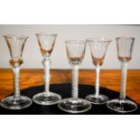 A group of 18th century drinking glasses to include a wine glass having a bell bowl design with