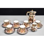A Royal Crown Derby Imari pattern coffee set comprising six cups and saucers, coffee pot and a cream