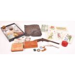A group of collectables to include various glass inkwells, vintage Elektra cap gun, silver handled