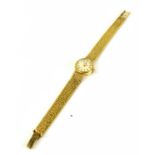 A 9ct gold Omega ladies wristwatch with baton dial, on a 9ct gold bracelet, 19.4g.