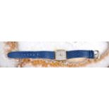 An Asprey & Garrard of London gold cased ladies wristwatch, baton dial and date aperture, quartz