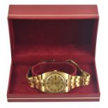 An 18ct gold Omega Constellation automatic gentleman's wristwatch, champagne coloured dial with