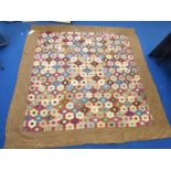 Victorian pieced patchwork quilt, the bordered square field with multiple polychrome wool and cotton