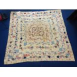 Victorian pieced framed patchwork quilt in predominantly pastel floral and plain chintzes, with
