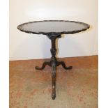 George III style mahogany tripod table, the shaped tilt top with birdcage action, on fluted column