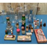 A Collection of Antique Apothecary bottles. Includes labeled bottles and some contain liquids.