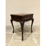 An Edwardian mahogany envelope top card table, the square top with four hinged sections, each inlaid