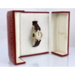 An 18ct three tone Cartier Vendome Trinity quartz wristwatch, the circular cream coloured dial