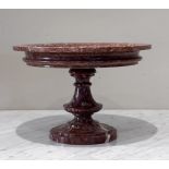 A Neo-classical style 'Grand Tour' rouge marble tazza, the shallow circular bowl upon a turned