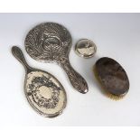 A George V, Art Nouveau silver backed hand mirror, William Neale & Son, Birmingham 1912, with