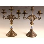A pair of Secessionist Movement porcelain and lacquered brass candelabra, each with three sconces,