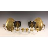 A pair of French glass and gilt metal wall sconces, each mirror back extending to two branches