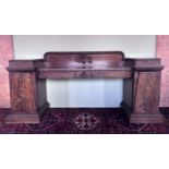 A large William IV mahogany pedestal sideboard of country house proportions, the gallery back with