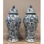 A pair of exceptionally large Chinese porcelain blue and white temple vases and covers, each floor