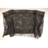 A black Chantilly skirt made from several joined flounces; together with eight good black net and