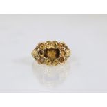 A 19th century French mourning ring setting, of cluster design and with central vacant panel to