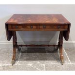 A Regency style mahogany sofa table, the rectangular top with two drop leaves, above a pair of