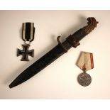 A German World War I period dagger, possibly police issue, the grip cast with an eagle's head