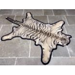 An early 20th century taxidermy Bengal tiger skin, Panthera Tigris, India, with felt backing,