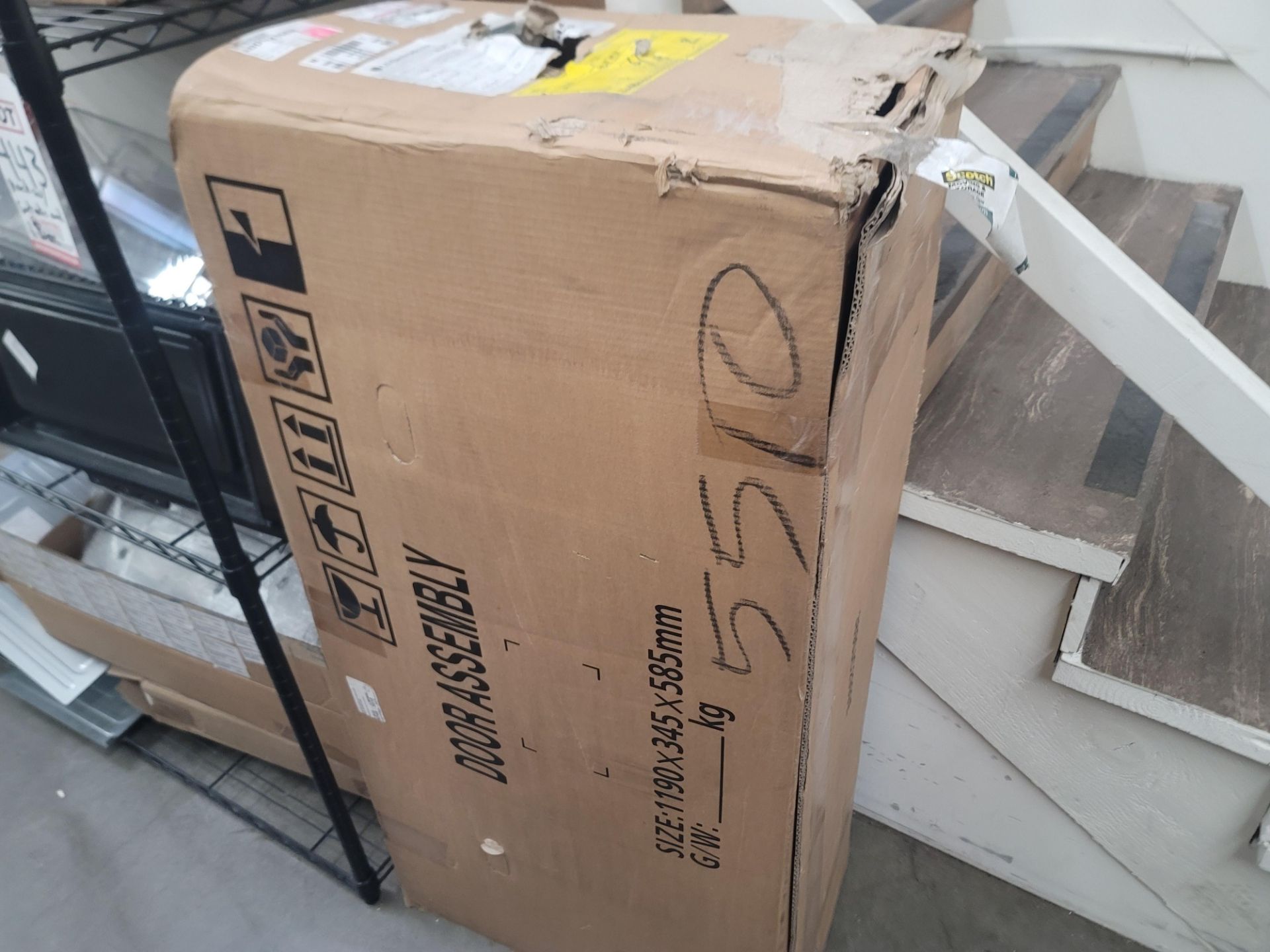 LOT - WIRE SHELF W/ CONTENTS AND LARGE BOX TO THE RIGHT TO INCLUDE APPLIANCE REPLACEMENT PARTS - Image 9 of 10