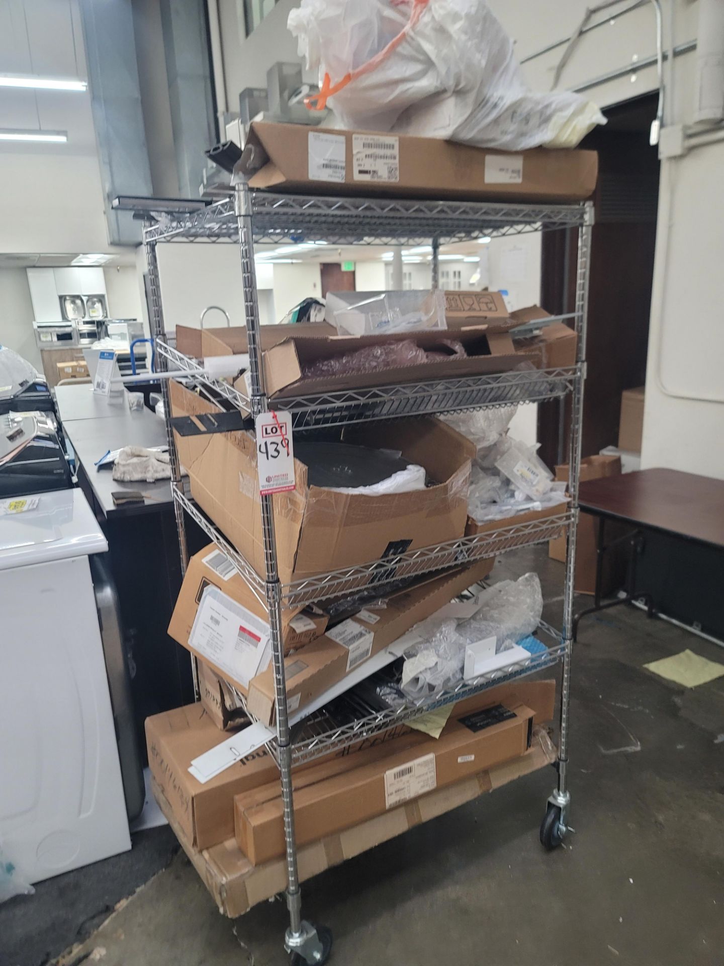 LOT - WIRE SHELF ON CASTERS, W/ CONTENTS OF APPLIANCE REPLACEMENT PARTS