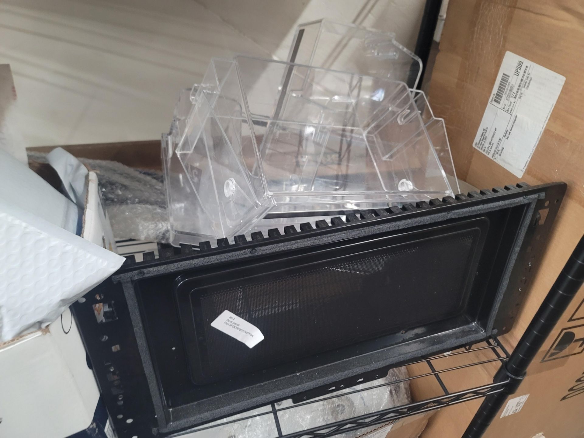 LOT - WIRE SHELF W/ CONTENTS AND LARGE BOX TO THE RIGHT TO INCLUDE APPLIANCE REPLACEMENT PARTS - Image 5 of 10