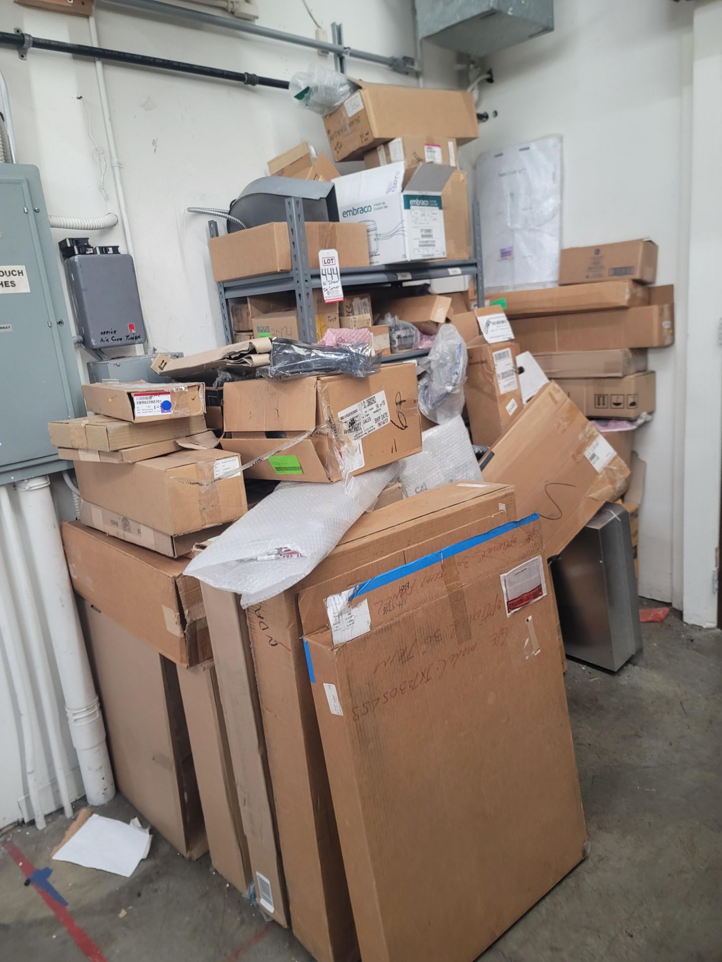 LOT - CONTENTS OF CORNER AREA, TO INCLUDE SHELF UNIT FULL OF APPLIANCE REPLACEMENT PARTS AND ALL