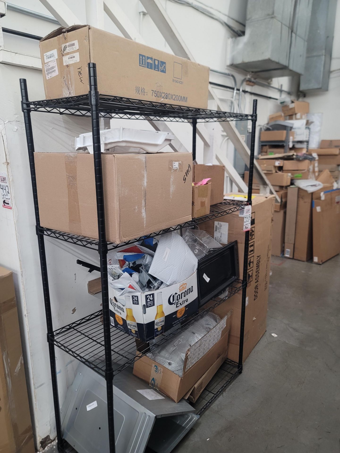 LOT - WIRE SHELF W/ CONTENTS AND LARGE BOX TO THE RIGHT TO INCLUDE APPLIANCE REPLACEMENT PARTS