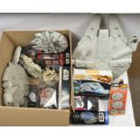 Assortment of Star Wars Millennium Falcon Collectibles including ships, puzzles and ephemera.