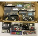 A mixed boxed group of die-cast models, predominantly 1:43 scale, including police cars, ambulanc...