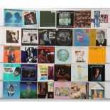 A collection of vinyl LPs spanning jazz, rock and roll, blues, and library music, featuring artis...