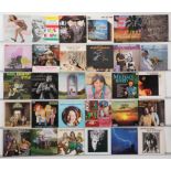 A collection of LPs spanning various genres including folk, easy listening, and pop