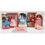 Mattel Barbie dolls x three and Disney Store x two boxed dolls and an outfit