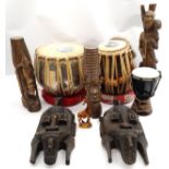 Ethnographic group and similar comprising of Hand Carved West African Tribal Artifacts which rese...