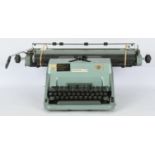 Imperial 70 typewriter, a pale green/teal manual typewriter with black keys. It ca…