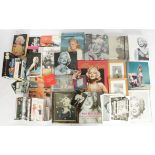 Large quantity of Marilyn Monroe related items. To include books, wall clock, pict…