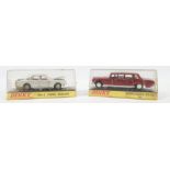 Dinky Toys, a pair of diecast models in original plastic cases. The lot comprises:…