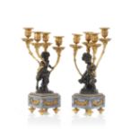 A pair of Louis XVI style four-light candelabra