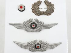 German WWII pressed metal visor cap cockade and wreath and two Luftwaffe cockades. UK P&P Group