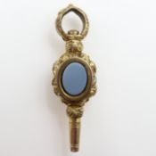 Victorian yellow metal watch key with hardstone to each side. UK P&P Group 0 (£7+VAT for the first