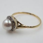 Vintage 9ct gold pearl set ring, surrounded by a halo of diamonds, size M, 1.2g. UK P&P Group 0 (£