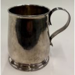 An 18th Century George I silver mug.