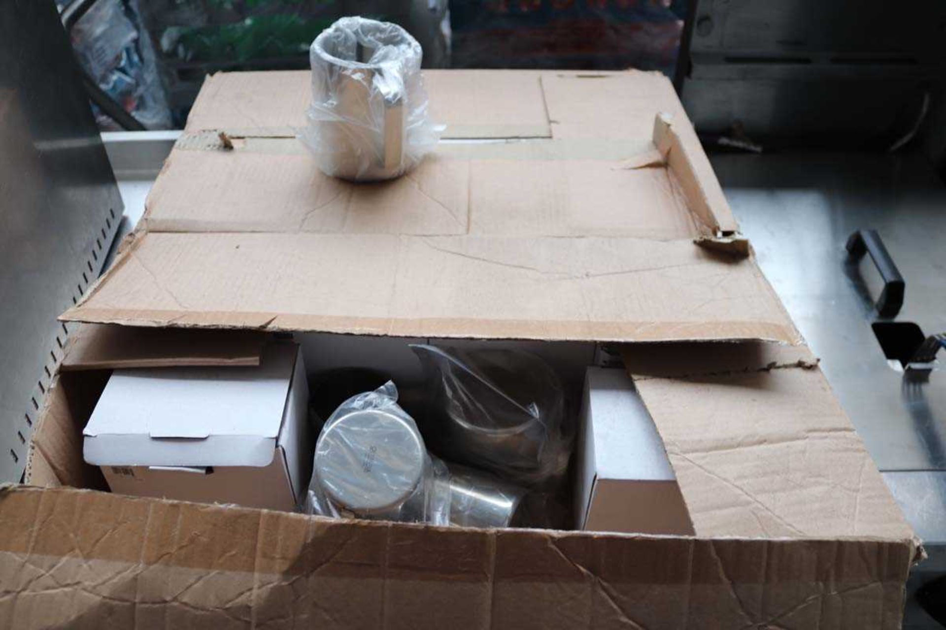 +VAT Two boxes of stainless steel jugs