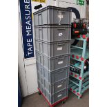 +VAT Stack of seven heavy duty plastic stacking crates containing champagne and wine glasses on a