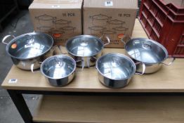 Ten piece stainless steel and glass lid pan set, unboxed