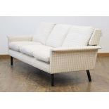 Attributed to Arne Vodder (Danish, 1926-2009) for Fritz Hansen, a three-seater sofa upholstered in