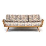 Lucien Ercolini for Ercol, an elm and beech sofa/daybed, with 'surfboard' back and curved spindled