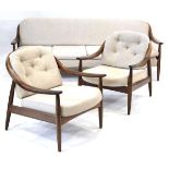 A 1960's Greaves & Thomas sofa bed with cream upholstered seats on a teak frame, w. 205 cm, together