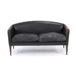 Illum Wikkelso (Danish, 1919-1999), a 1960's two-seater V11 sofa upholstered in black leather, on
