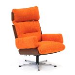 A 1970's armchair designed by Guy Rogers of Liverpool, with ply shells and later orange fabric